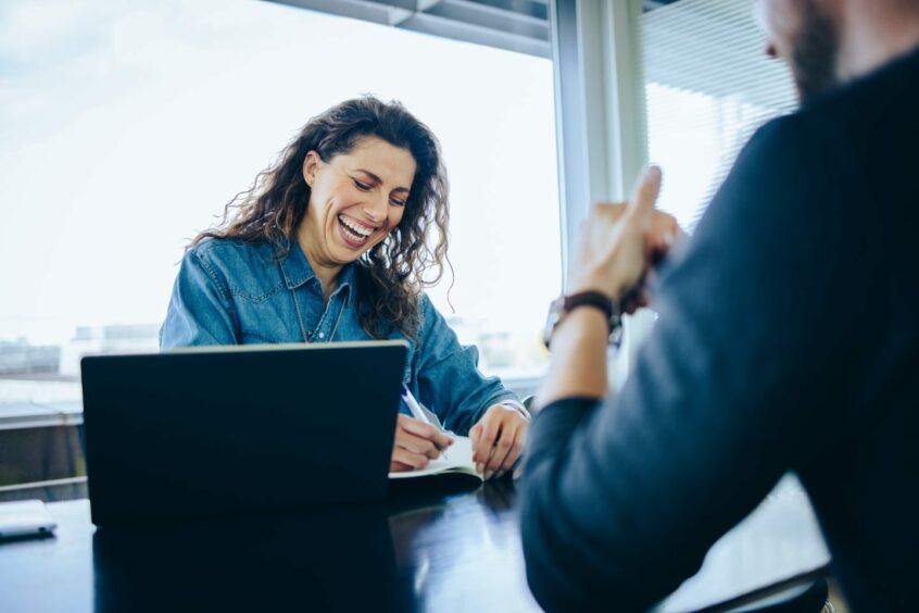 Employer laughing at charismatic candidate during interview