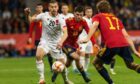 Ylber Ramadani in action for Albania against Spain.
