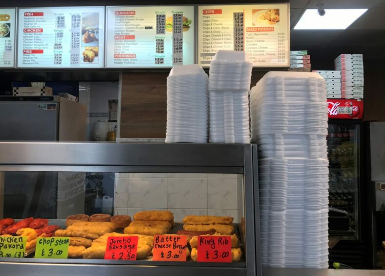 Single use containers stacked up in a takeaway shop in Aberdeen