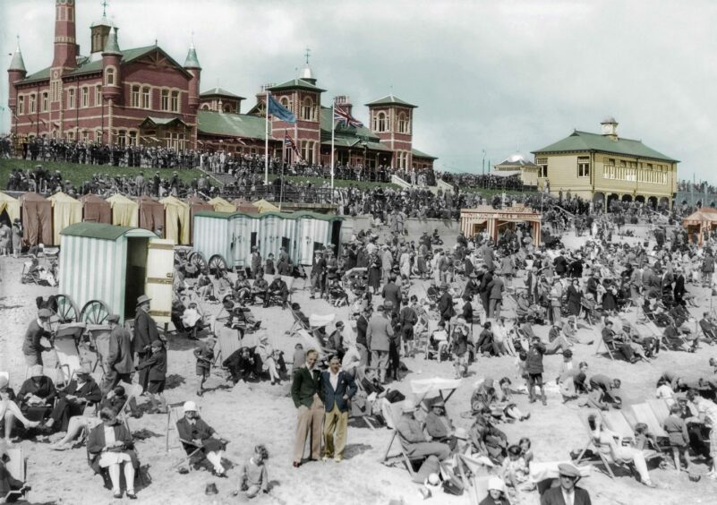 Huge crowds grace Aberdeen Beach in this 1930s picture, to which we've added colour, with the iconic Beach Baths building dominating the skyline.