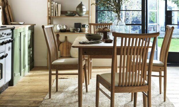 Ercol Teramo Medium Extending Dining Table and four chairs, £2,265, Gaucho Ceiling Light, £69, Ercol Ballatta Shelf Unit, £755, Furniture Village.