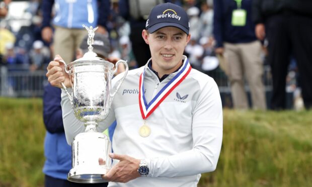Matt Fitzpatrick with the championship trophy after his US Open win in Boston.