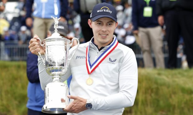 Matt Fitzpatrick with the championship trophy after his victory in Boston on Sunday.