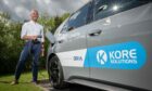 Kore Solutions managing director Duncan Booth charging an EV.