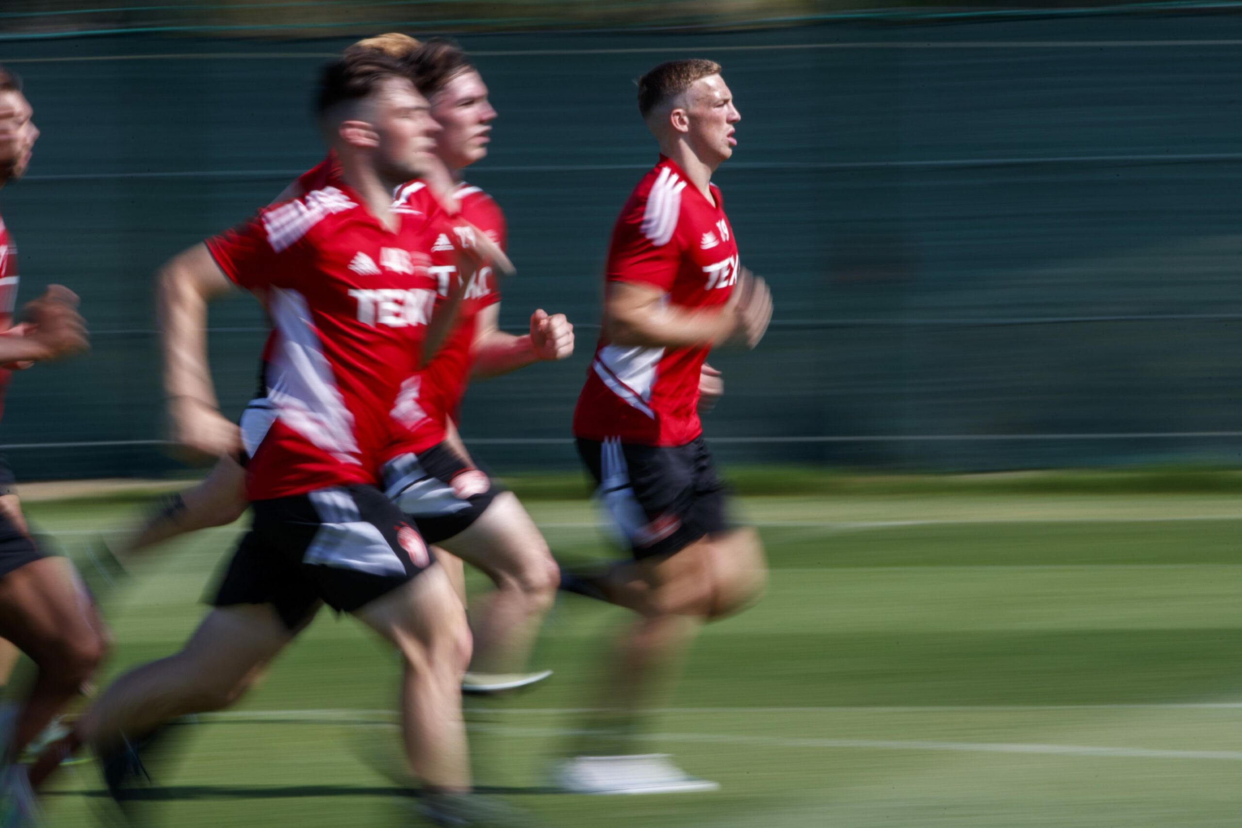 Lewis Ferguson running at a training session in Spain.