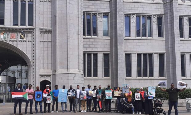 The protestors gathered outside Marischal College.