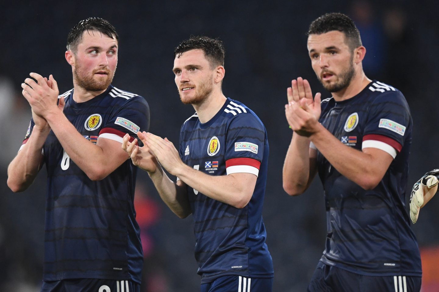 Scotland's John Souttar, Andy Robertson and John McGinn after beating Armenia at Hampden.