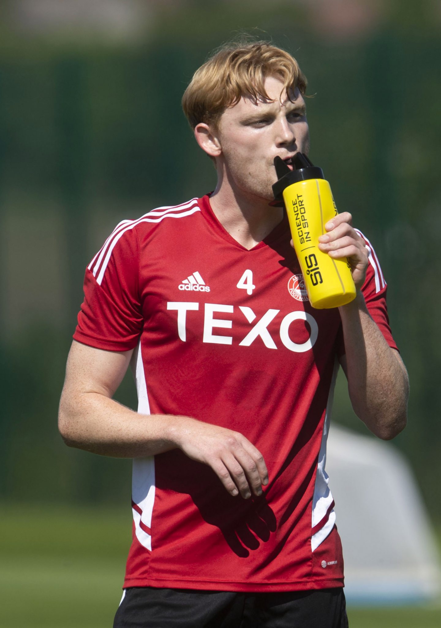 Thirsty work. Loan signing Liam Scales takes a drink after training with his new team-mates.