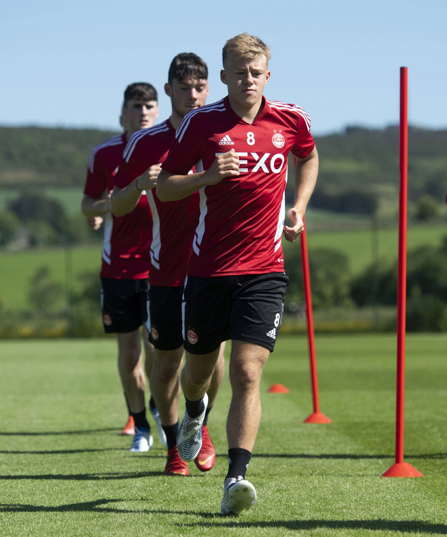 Teenage midfielder Connor Barron leads the way during a training session.