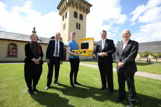 At the launch of the Moray Digital Health Centre of Excellence were Irene McAra-McWilliam, Richard Lochhead, Reece Moyes, Iain Stewart and George Crooks. Photo by Paul Campbell.