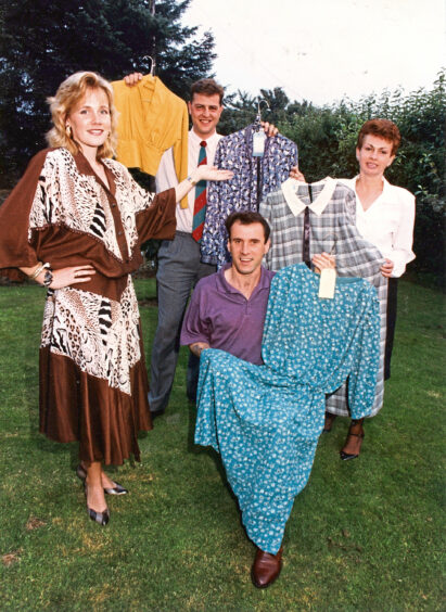 Fiona Mair, left, models a Bet Lynch dress. With Fiona are, from left, Murray Morrison, Colin McHardy and Jennifer Boyd in 1991