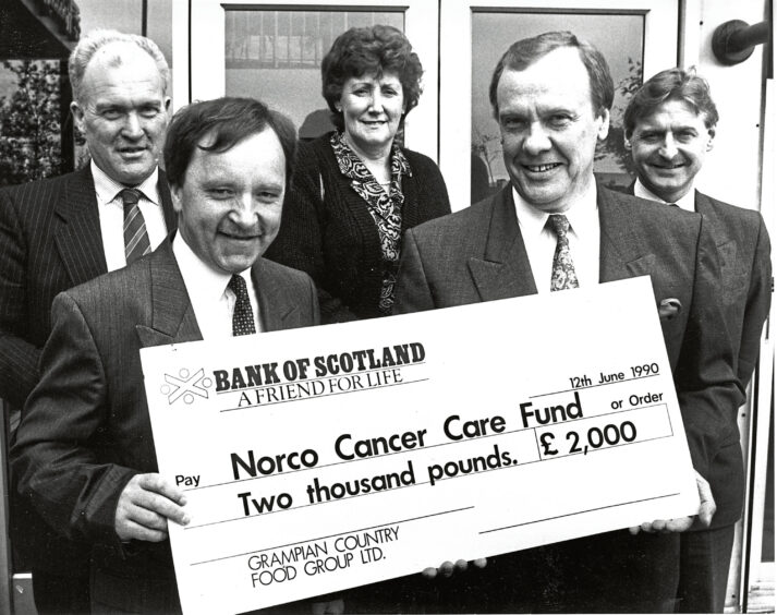 Allan Catto and Brian Duguid with a cheque for Norco Cancer Care Fund in 1990