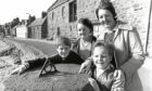 from left, Alasdair Orr, 9, with his mother Dorothy, and Ian Riddell, 8, with his mother May At Stonehaven Harbour in 1982
