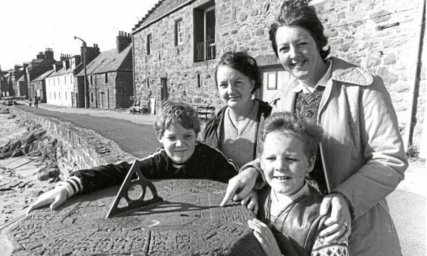 from left, Alasdair Orr, 9, with his mother Dorothy, and Ian Riddell, 8, with his mother May At Stonehaven Harbour in 1982