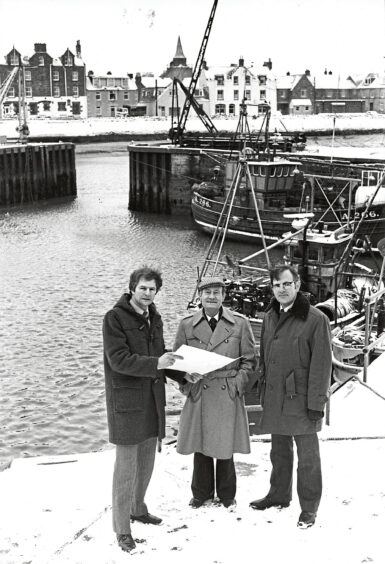 Hugh Jamieson, Ian Robertson and John Adams at Stonehaven Harbour looking at plans in 1981