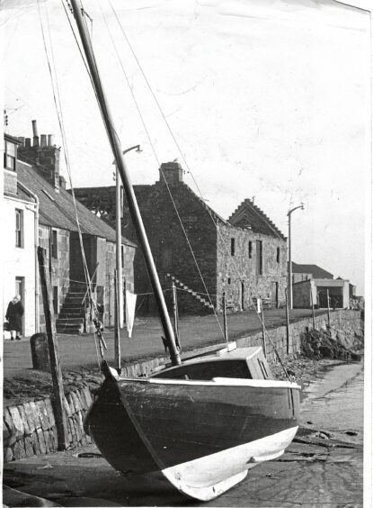 A view of Stonehaven harbour with the old tolbooth roofless in the background in 1961