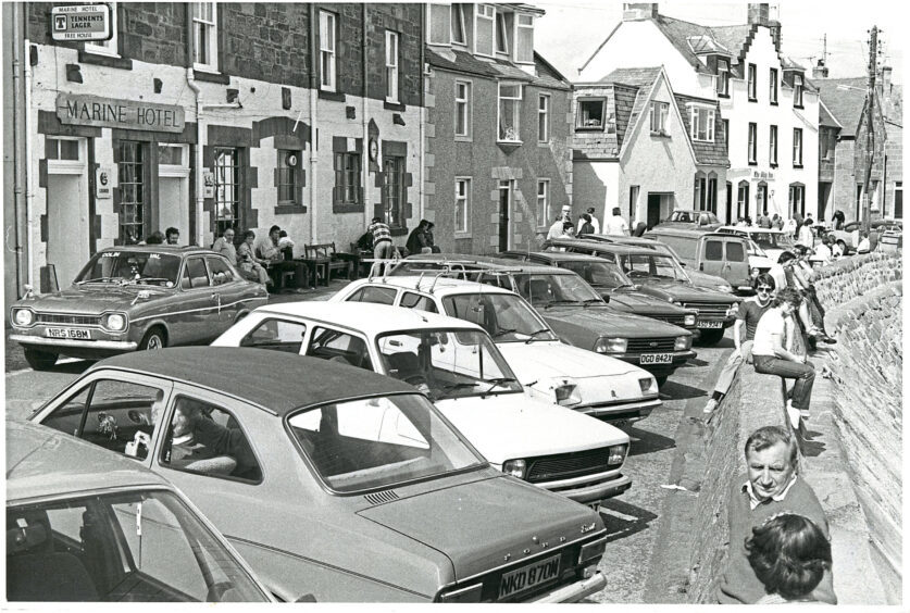 Cars parked along the front of Stonehaven harbour in 1982
