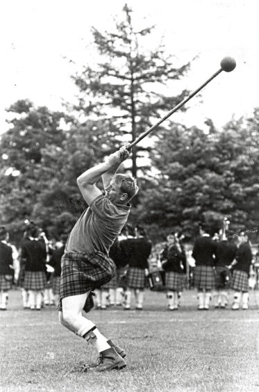 Neil Fyvie from Aboyne throwing the hammer during a heavys event at Aberdeen Highland Games in 1988