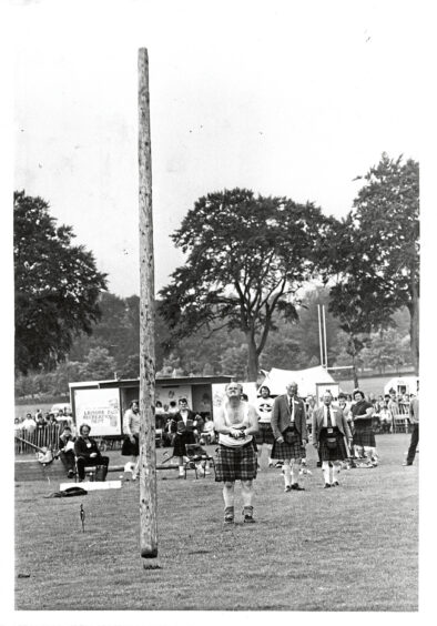 Bill Anderson tosses a caber at the Aberdeen Highland Games in 1984
