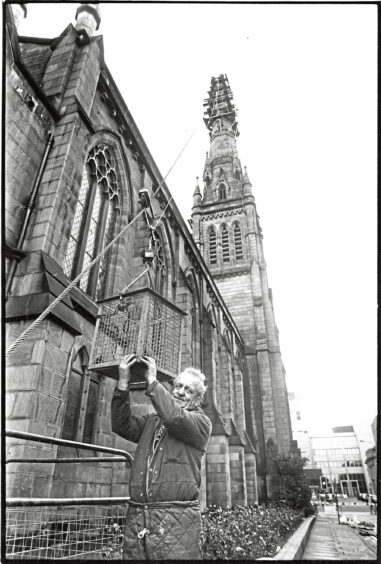 Steeplejack Frank Hughes checks the cradle which leads to the spire of the Langstane Kirk in Aberdeen.