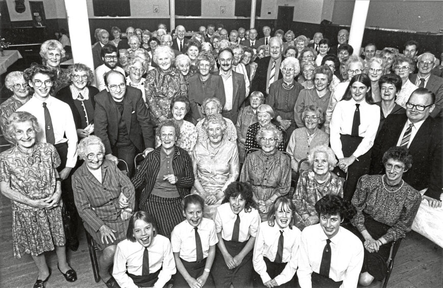 The Rev Laurie Y Gordon with some of the members of John Knox Church at the Congregational Supper held in the church hall, Mounthooly, Aberdeen.