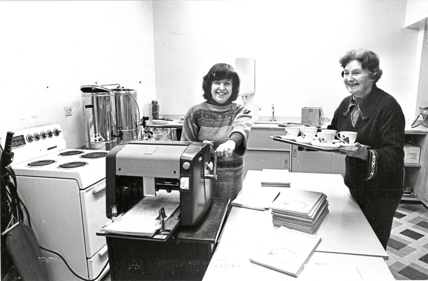 Church secretary Kathleen Barber and Woman's Guild tea convener Mary Brown work behind the scenes on the church magazine at Mannofield Church in Aberdeen, 1981.