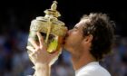 Andy Murray with the Wimbledon trophy he won in 2016. Image: Shutterstock