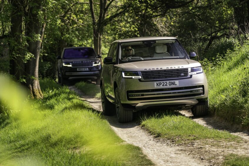 The latest model of Range Rover on a forest road