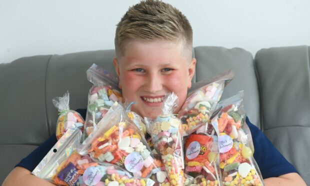 Alfie Mutch from Kingseat has started a sweetie business a few months ago. Picture by Chris Sumner.