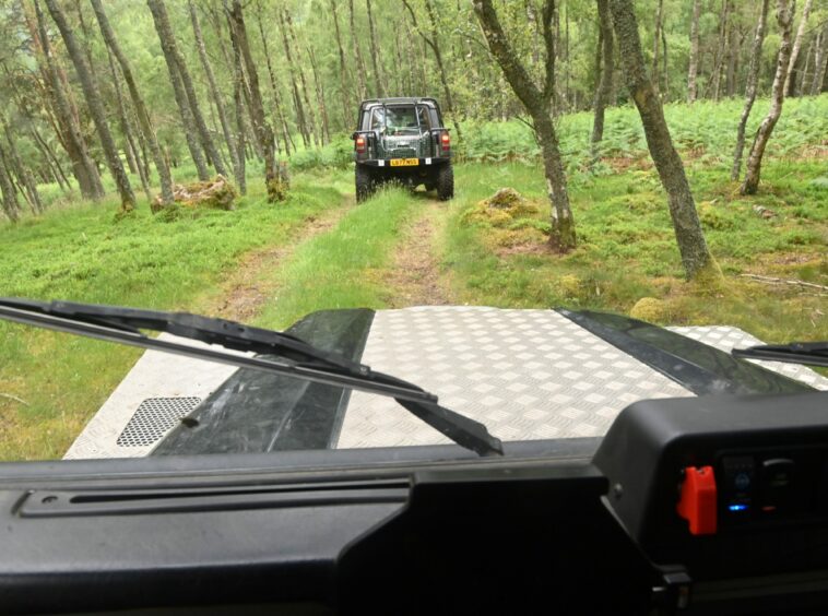 The view of the track from the front windshield of the car.