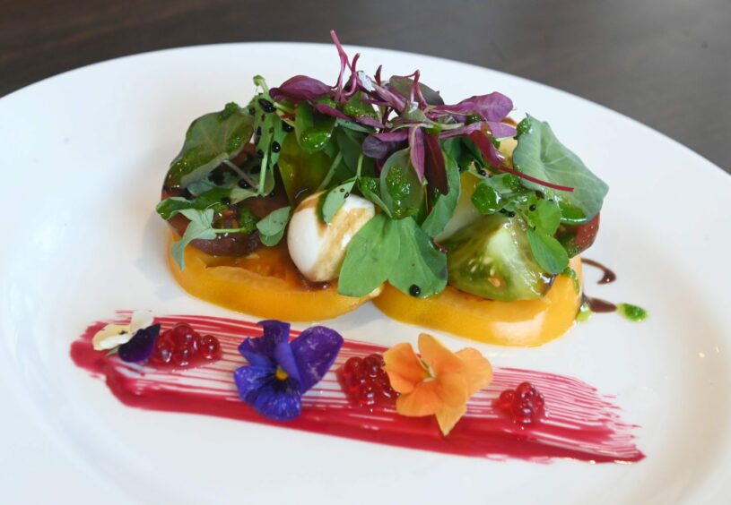 Heritage tomato salad with textures of beetroot, boccocini and micro salad.