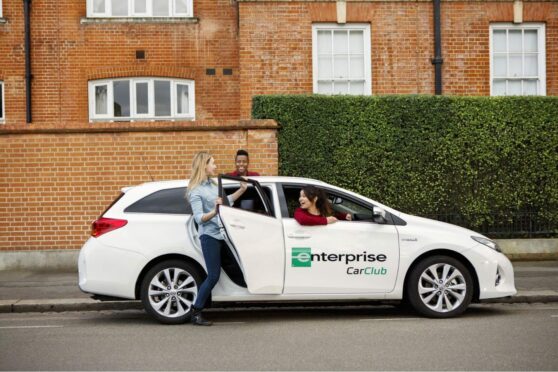 a group of friends get into a car for hire in Aberdeen's Enterprise Car Club