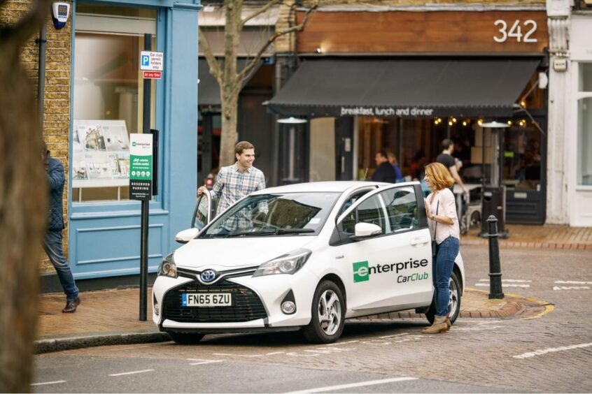 a man and a woman get inside a car for hire from Aberdeen's Enterprise Car Club