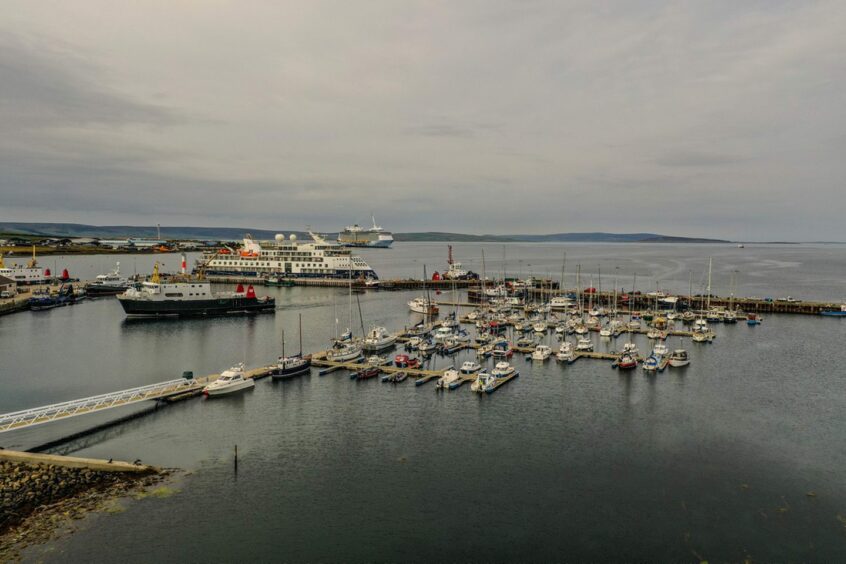 sea vessels docked at a pier in the Orkney Islands