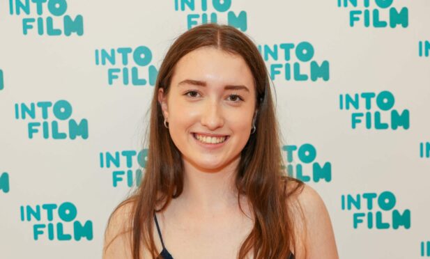 Young filmmaker Zoe Low with her award.