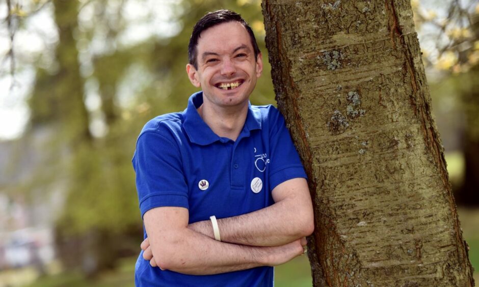 Future Choices chairman David Forbes leaning against a tree and smiling