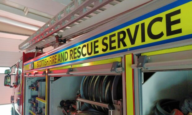 The side of a Scottish fire truck.