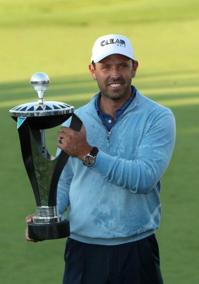 Charl Schwartzel with the LIV Golf Invitational individual trophy