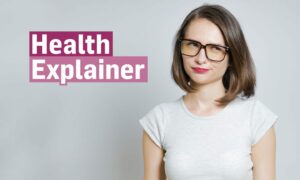 Pouting passive aggressive woman next to 'Health Explainer' logo