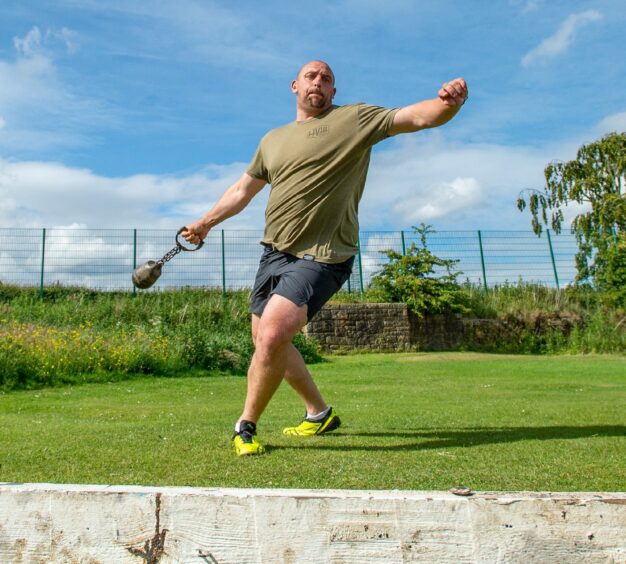 Mr Randalls practicing throwing techniques.