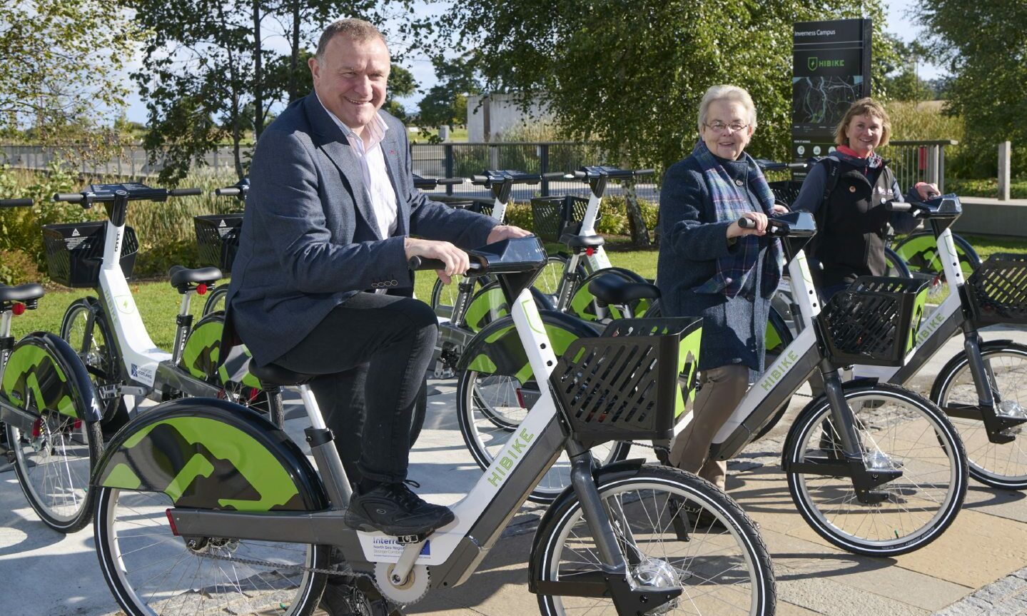 MP Drew Hendry with Councillor Trish Robertson and Hitrans active travel officer Vikki Trelfer on Hi-Bikes.