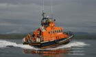 Oban lifeboat crews were called out to assist two people who had to abandon their fishing vessel.