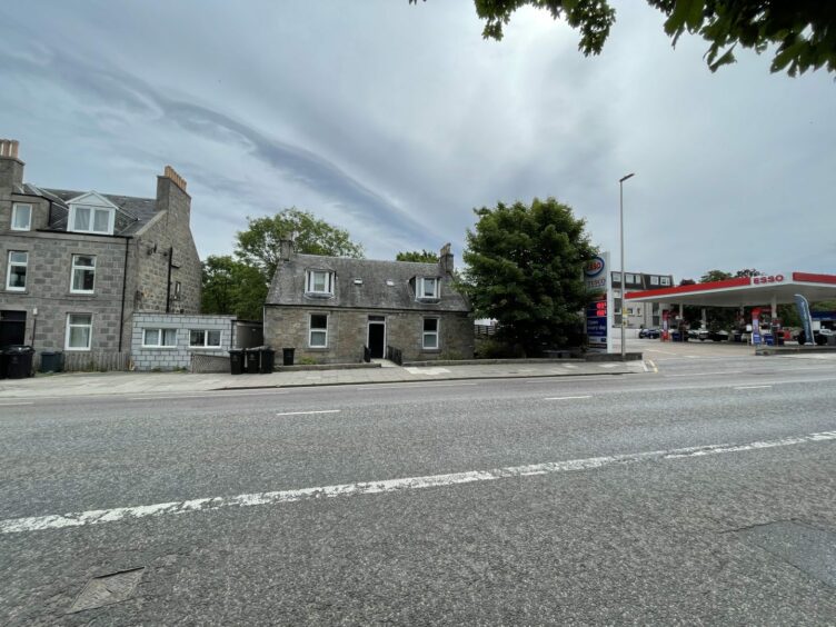 Richard Smith's former home address, where police closed the road, was next to a petrol station.