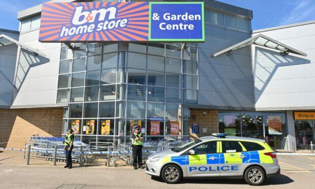 B&M store in Elgin is currently closed by police. Picture by Jason Hedges.