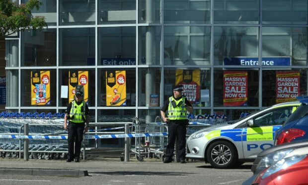 Police sealed off the entrance to Elgin's B&M store on Thursday morning. Picture by Jason Hedges.