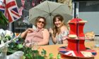 Anne Mightens, left, and Claie Gudden turned out to enjoy the Jubilee street party in Dingwall. Picture by Jason Hedges.