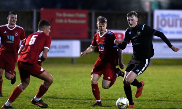 Forward Connor Bunce, right, in action for Clach at Deveronvale last season.