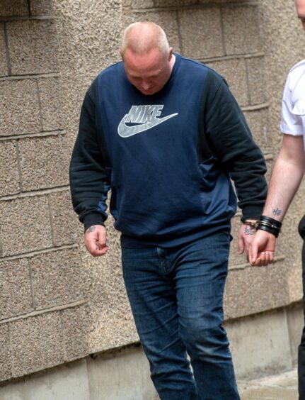 Simon Butler is taken to prison after being sentenced.