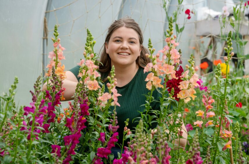 Natalie among her vibrantly coloured flowers.