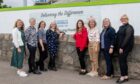 Hoardings have been erected in front of the new facilities. From left, Lisa Duthie Endowment Charity Lead Officer NHS Grampian, Jackie Bremner Project Director, Paula Cormack Chief Executive of the Archie Foundation, Kelly M Anderson University of Aberdeen, Sarah-Jane Hogg Friends of Anchor, Carolyn Annand Project Nurse, Jayne Forrest Project Midwife and Lauren Tweedley Coms and Engagement Lead for the project., 
Picture by Kath Flannery.